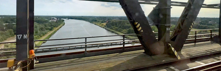 Hamburg to Copenhagen train approaches the Rendsburg Bridge